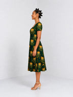 "Matawi" Sweetheart Midi Dress — side view on model