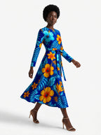 "Maua" Long Sleeve Midaxi Dress — three-quarter view on model, hand in the side pocket