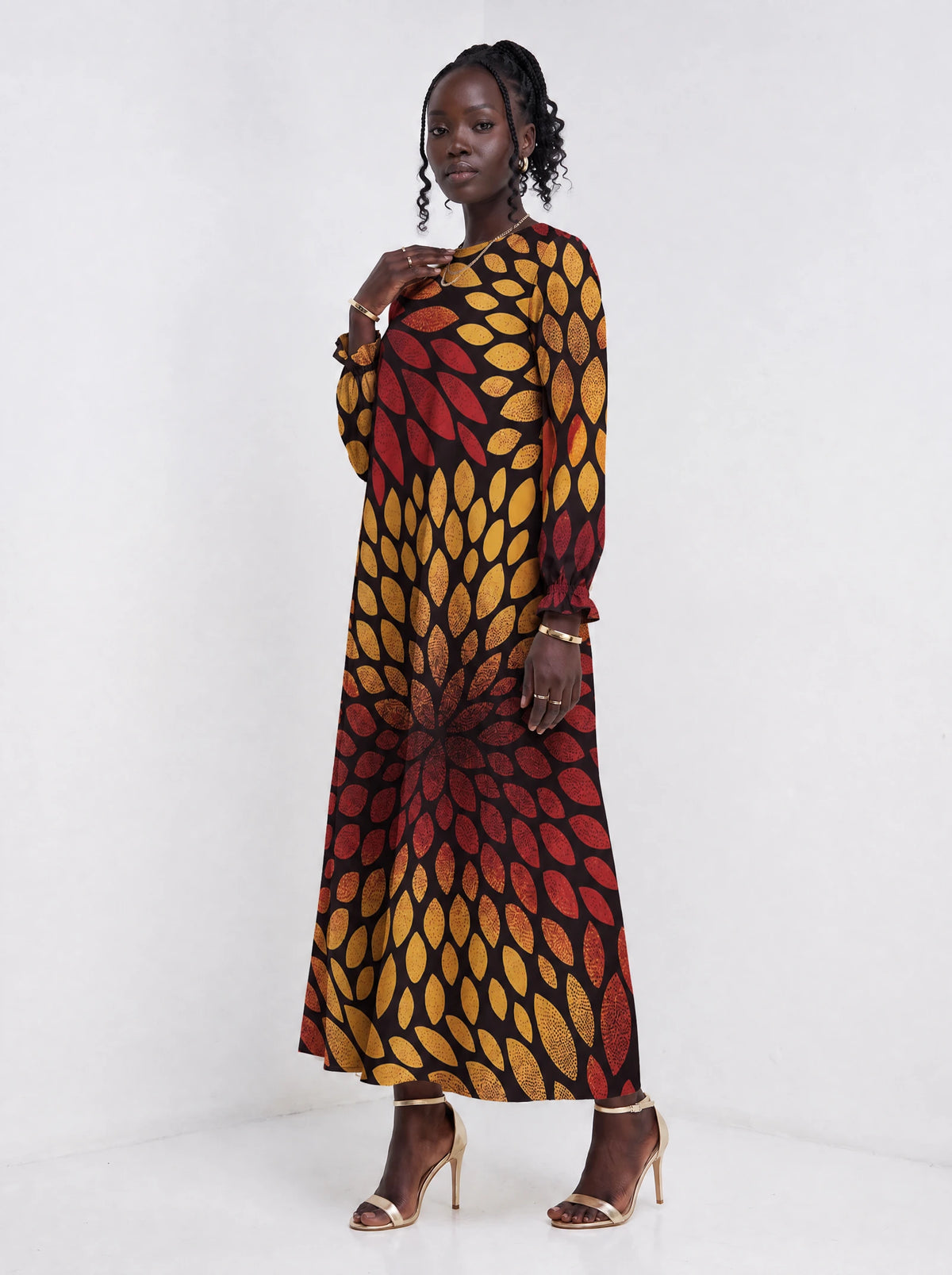 "Mavuno" Long Sleeve Maxi Dress — three-quarter view on model