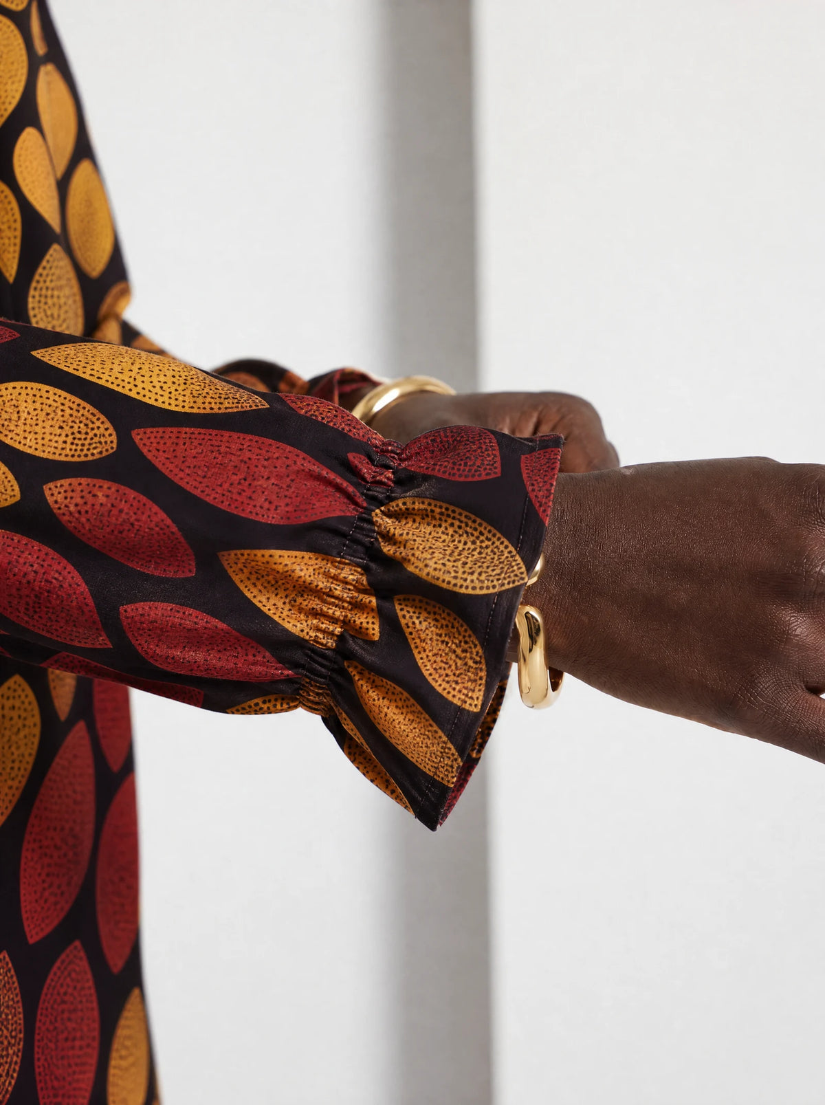 "Mavuno" Long Sleeve Maxi Dress — close-up of the gathered ruffle cuff at the wrist