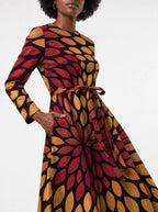 "Mavuno" Long Sleeve Midaxi Dress — close-up of the tie sash and the in-seam side pocket