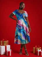 "Mawingu" Sweetheart Midi Dress — on model, Christmas backdrop