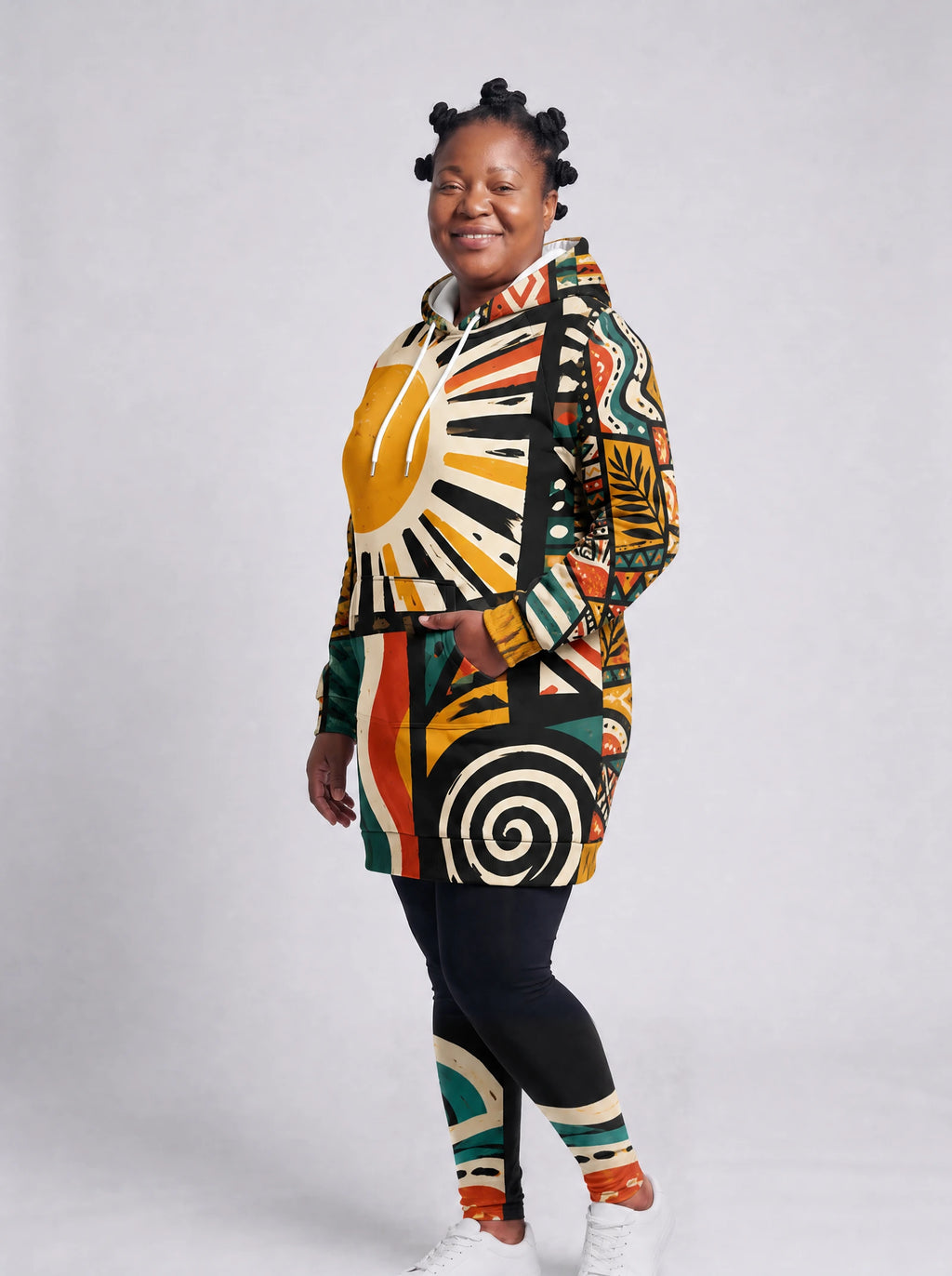 "Mawio" Hoodie Dress — three-quarter view on a plus-size model, hand in pocket, styled with the matching leggings