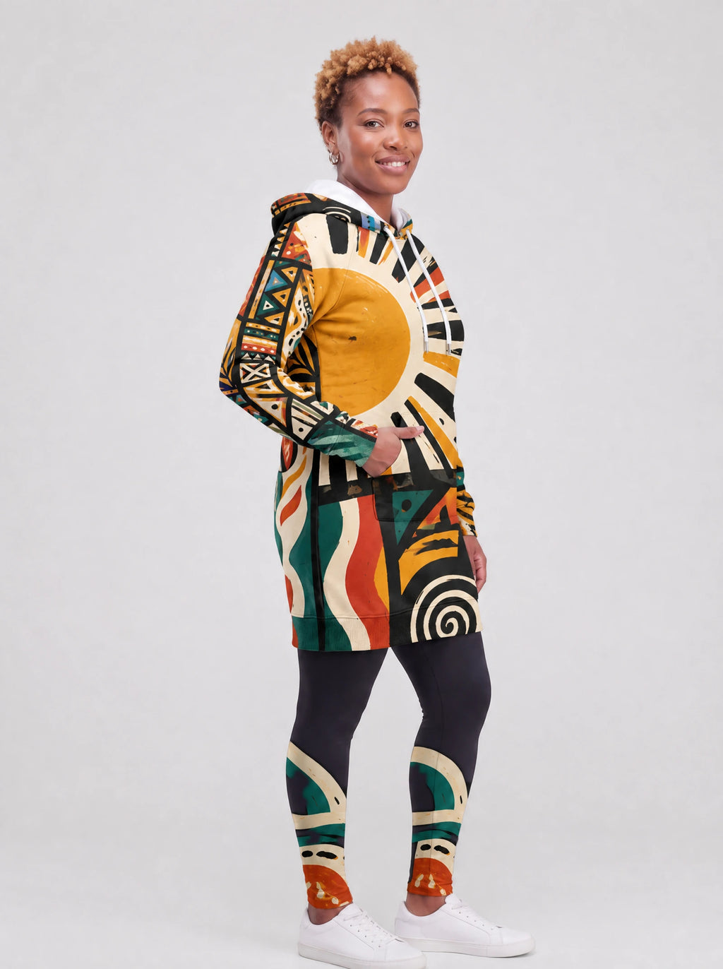 "Mawio" Hoodie Dress — three-quarter view on model, hand in pocket, styled with the matching leggings