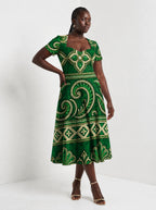 "Mchoro" Sweetheart Midi Dress — walking, three-quarter view on model
