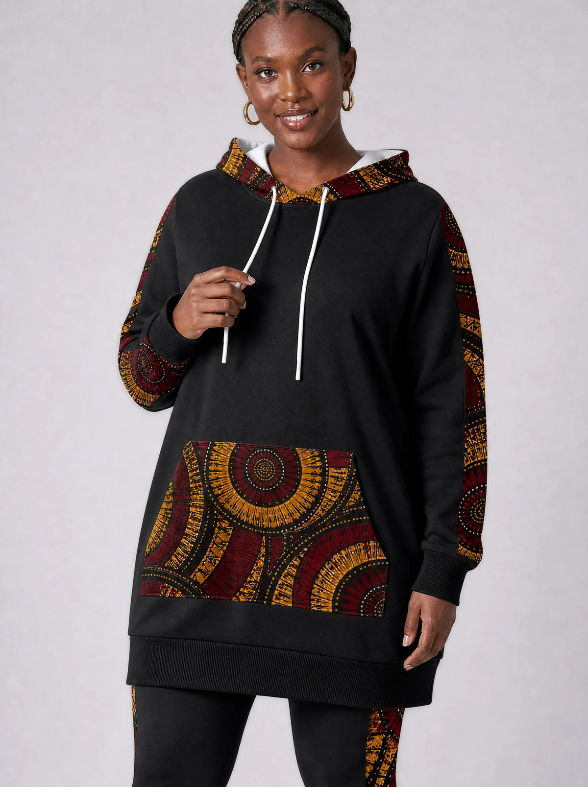 "Mduara" Hoodie Dress — close-up on model, styled with the matching leggings