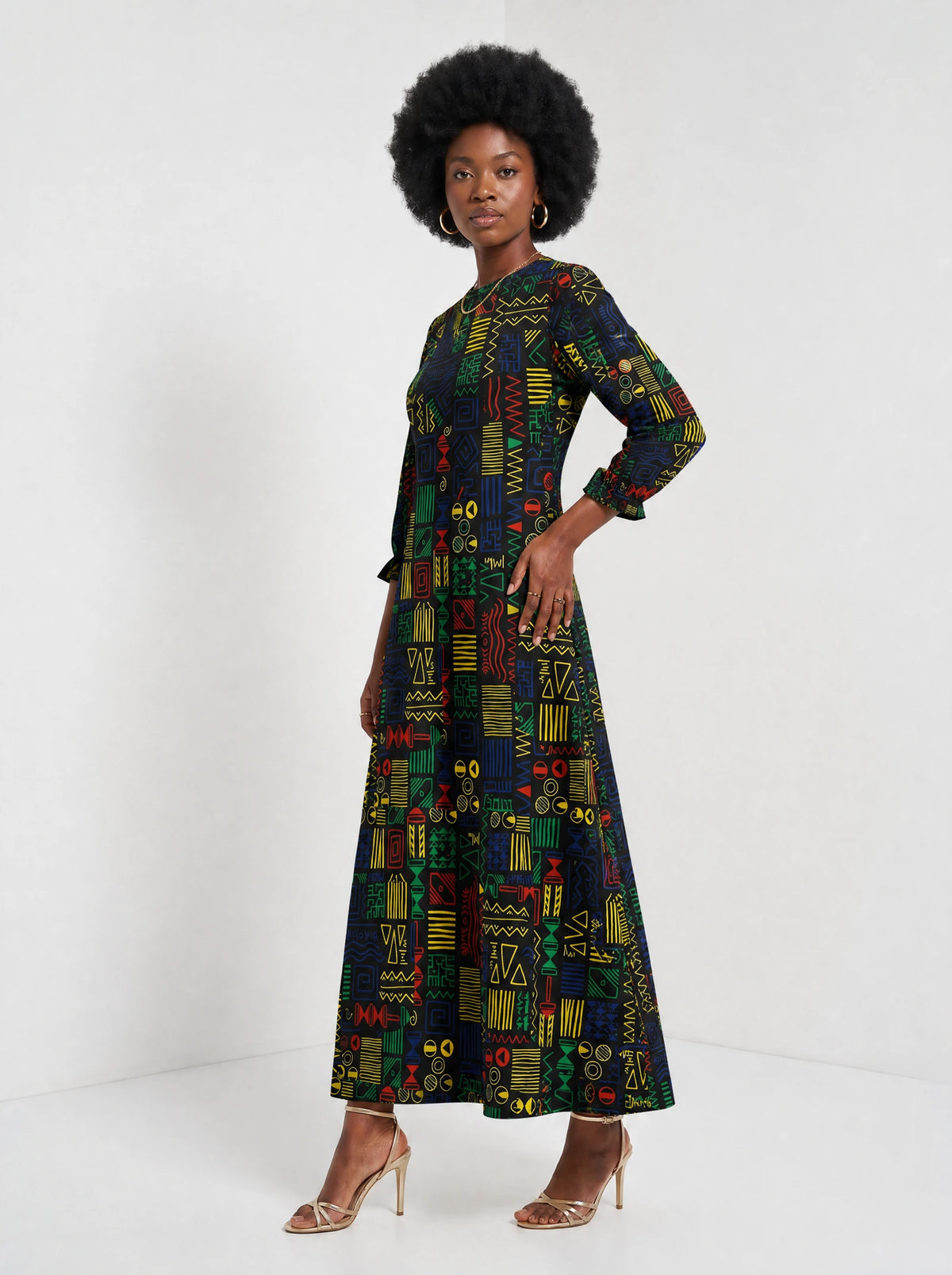 "Michoro" Long Sleeve Maxi Dress — three-quarter view on model