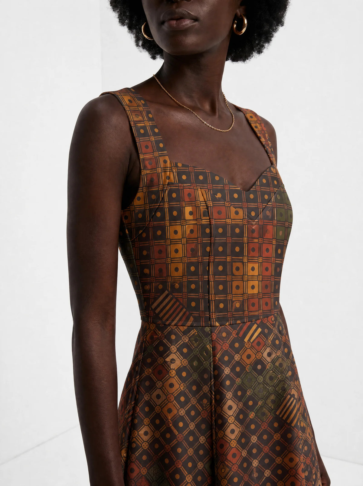 "Mkeka" Corset Dress — close-up of the sweetheart neckline and shoulder strap