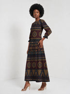 "Msuko" Long Sleeve Maxi Dress — three-quarter view on model