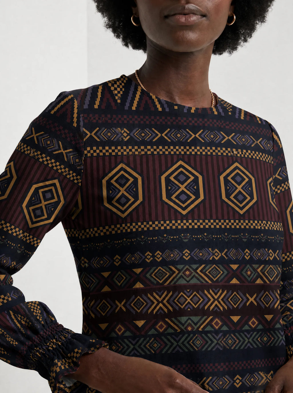 "Msuko" Long Sleeve Maxi Dress — close-up of the high round neckline