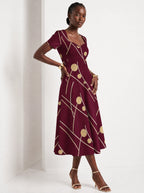 "Mvinyo" Sweetheart Midi Dress — walking, three-quarter view on model