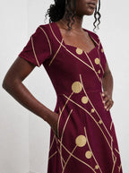 "Mvinyo" Sweetheart Midi Dress — standing, angled view on model