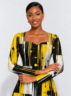 "Mvua" Long Sleeve Sweetheart Midi Dress — print close-up on model