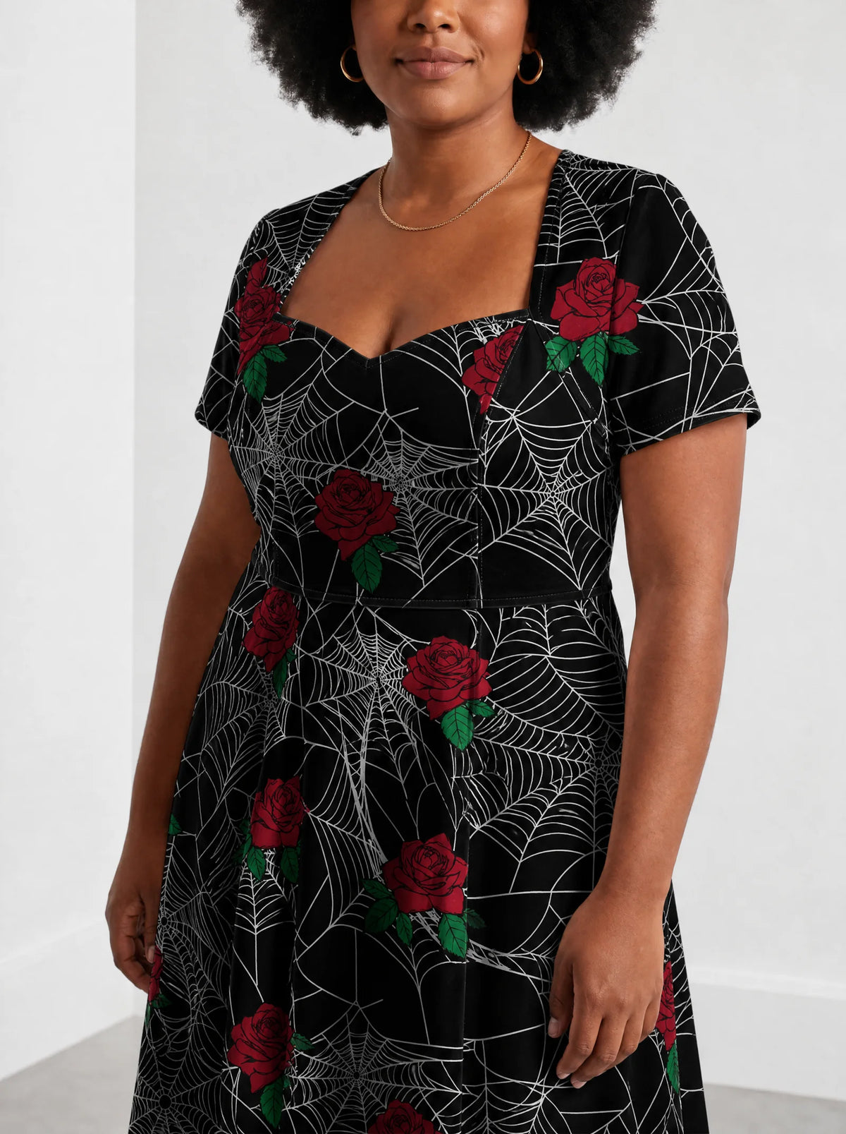 "Mwiba" Halloween Sweetheart Midi Dress — close-up of the sweetheart neckline and short sleeve
