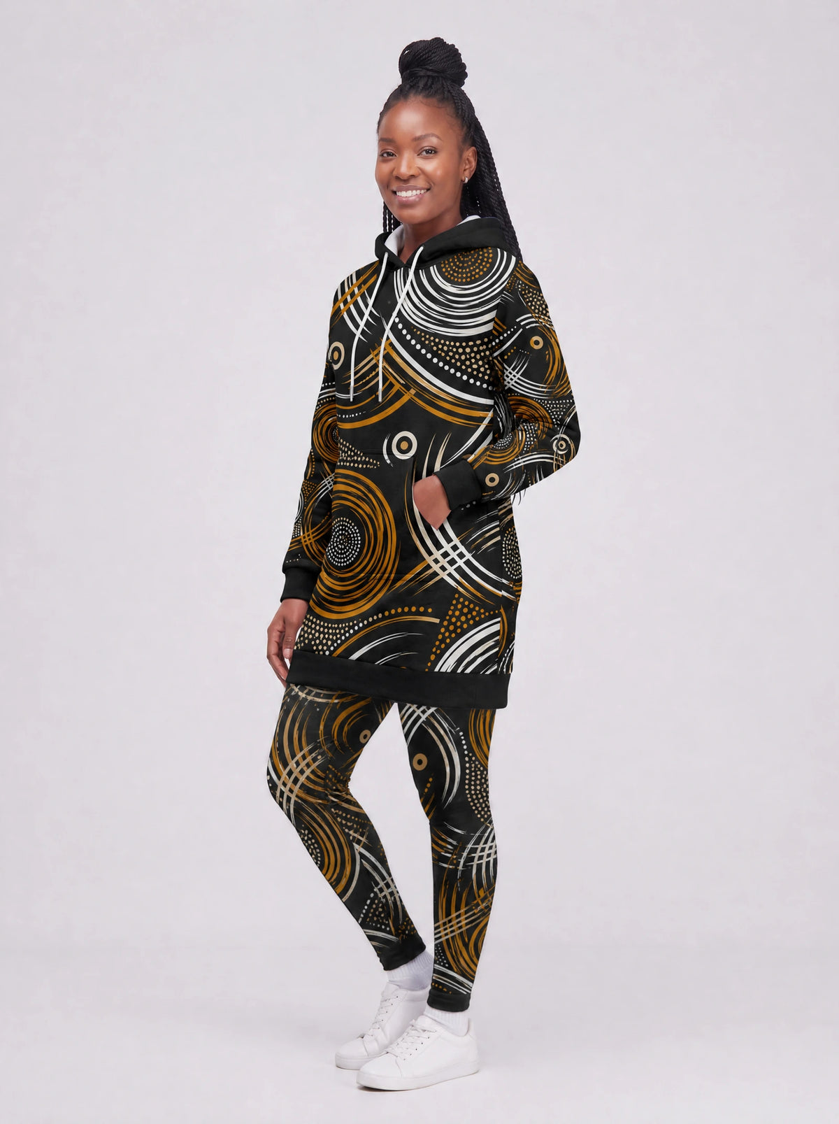 "Mzunguko" Hoodie Dress — three-quarter view on model, styled with the matching leggings