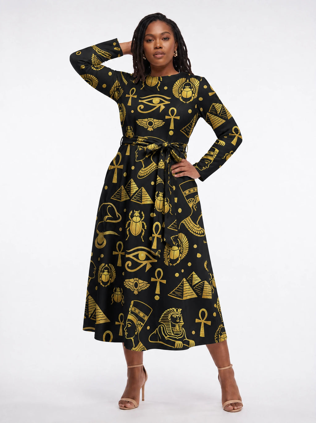 "Nefertiti Black Gold" Long Sleeve Midaxi Dress — three-quarter view on model, hand in the side pocket