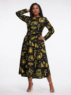 "Nefertiti Black Gold" Long Sleeve Midaxi Dress — three-quarter view on model, hand in the side pocket