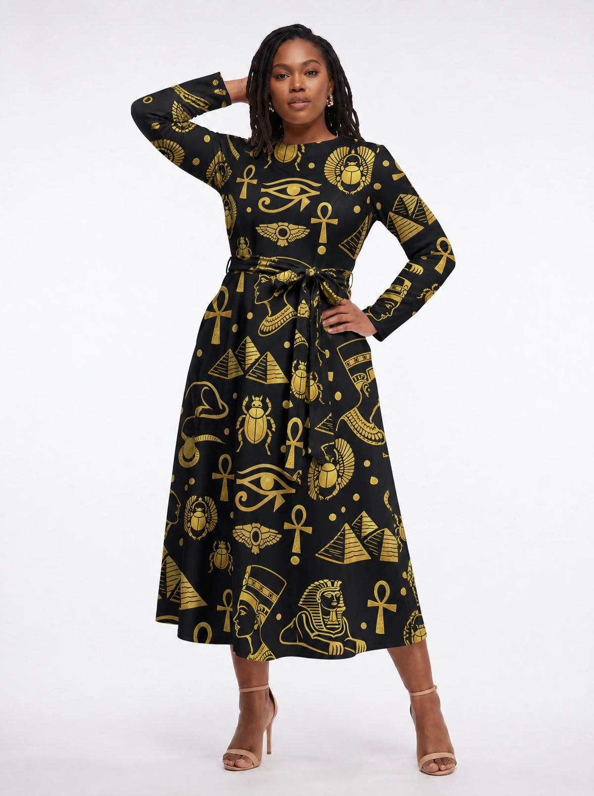"Nefertiti Black Gold" Long Sleeve Midaxi Dress — three-quarter view on model, hand in the side pocket