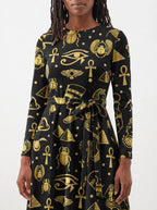 "Nefertiti Black Gold" Long Sleeve Midaxi Dress — close-up of the tie sash and the in-seam side pocket
