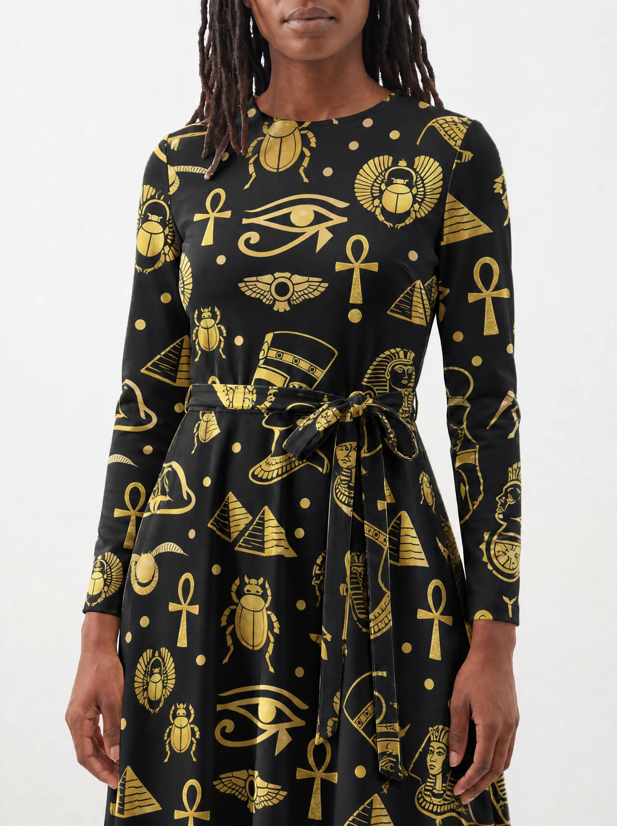 "Nefertiti Black Gold" Long Sleeve Midaxi Dress — close-up of the tie sash and the in-seam side pocket