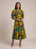 "Njano" Puff Sleeve Dress — walking, three-quarter view on model