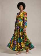 "Njano" Puff Sleeve Maxi Dress — walking, three-quarter view on model