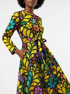 "Njano" Long Sleeve Midaxi Dress — close-up of the tie sash and the in-seam side pocket