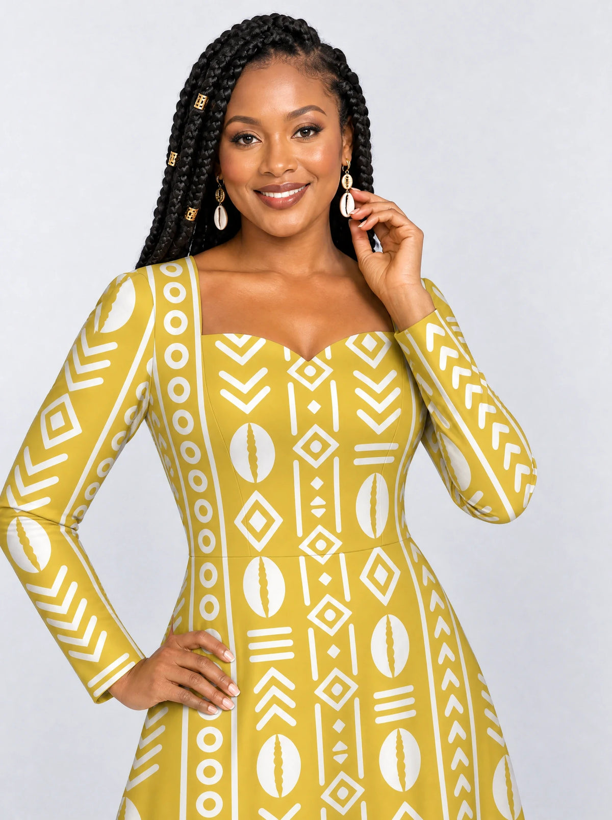 "Oshun Dhahabu" Long Sleeve Sweetheart Midi Dress — print close-up on model