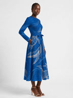 "Pwani" Long Sleeve Midaxi Dress — three-quarter view on model, hand in the side pocket