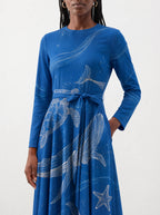 "Pwani" Long Sleeve Midaxi Dress — close-up of the tie sash and the in-seam side pocket