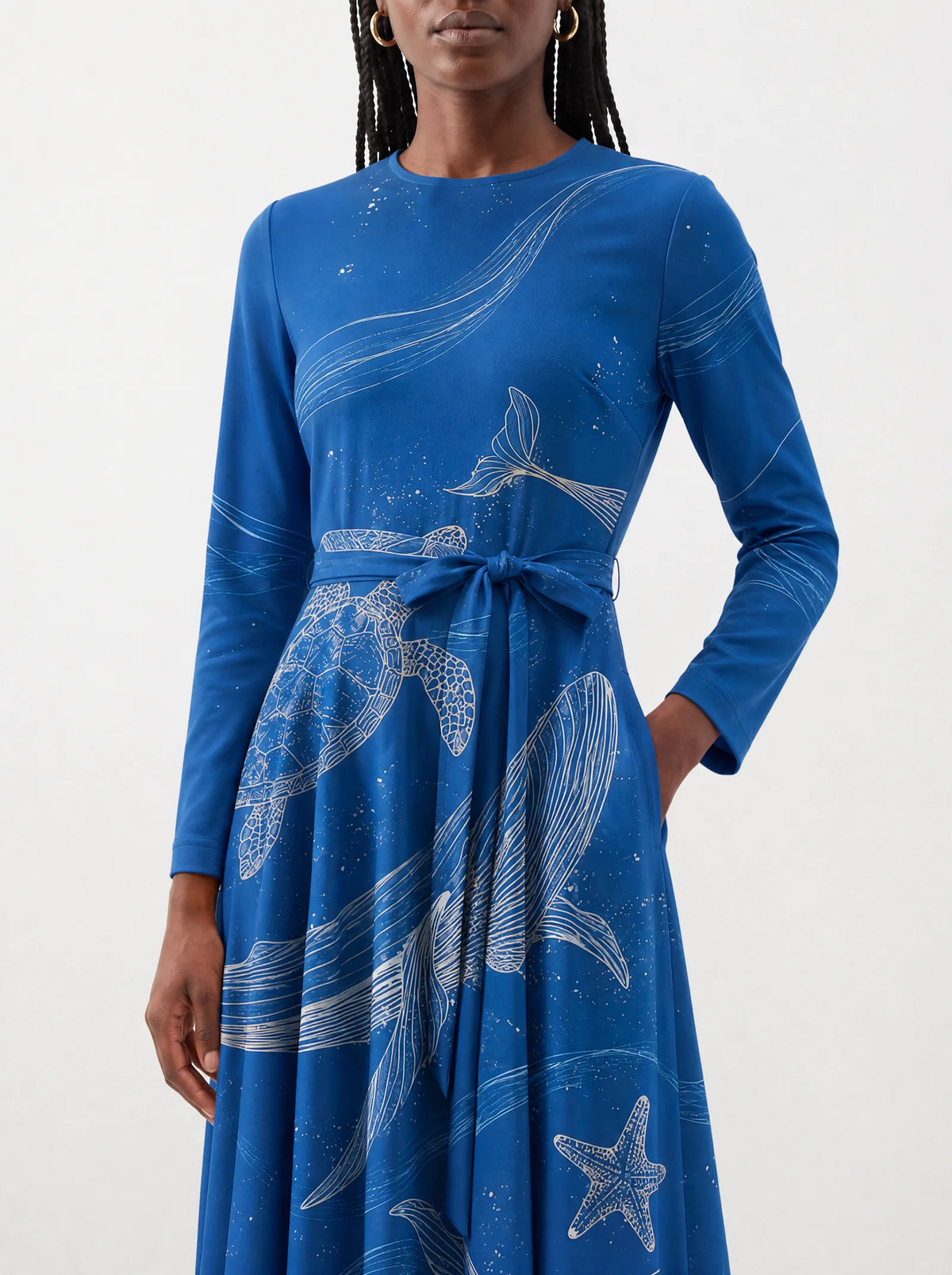 "Pwani" Long Sleeve Midaxi Dress — close-up of the tie sash and the in-seam side pocket