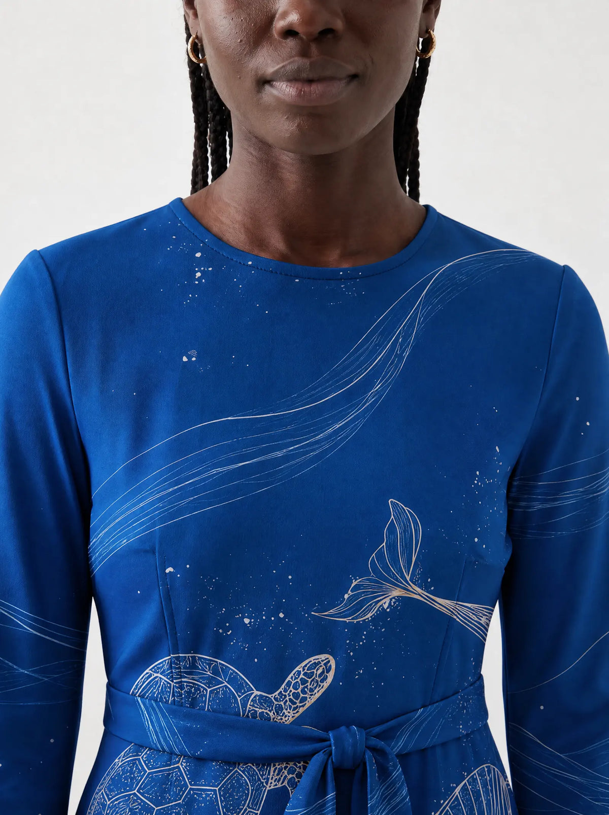 "Pwani" Long Sleeve Midaxi Dress — close-up of the round neckline and long sleeve