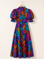 "Rangi" Puff Sleeve Dress — the dress on a hanger, back