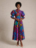 "Rangi" Puff Sleeve Dress — walking, three-quarter view on model