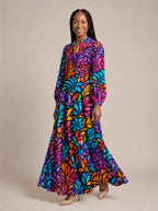 "Rangi" Puff Sleeve Maxi Dress — walking, three-quarter view on model