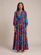 "Rangi" Puff Sleeve Maxi Dress — standing, angled view on model