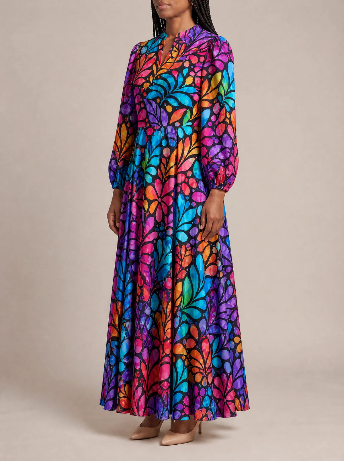 "Rangi" Puff Sleeve Maxi Dress — three-quarter view on model