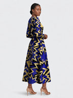 "Royal Blue Sheba" Long Sleeve Midaxi Dress — three-quarter view on model, hand in the side pocket