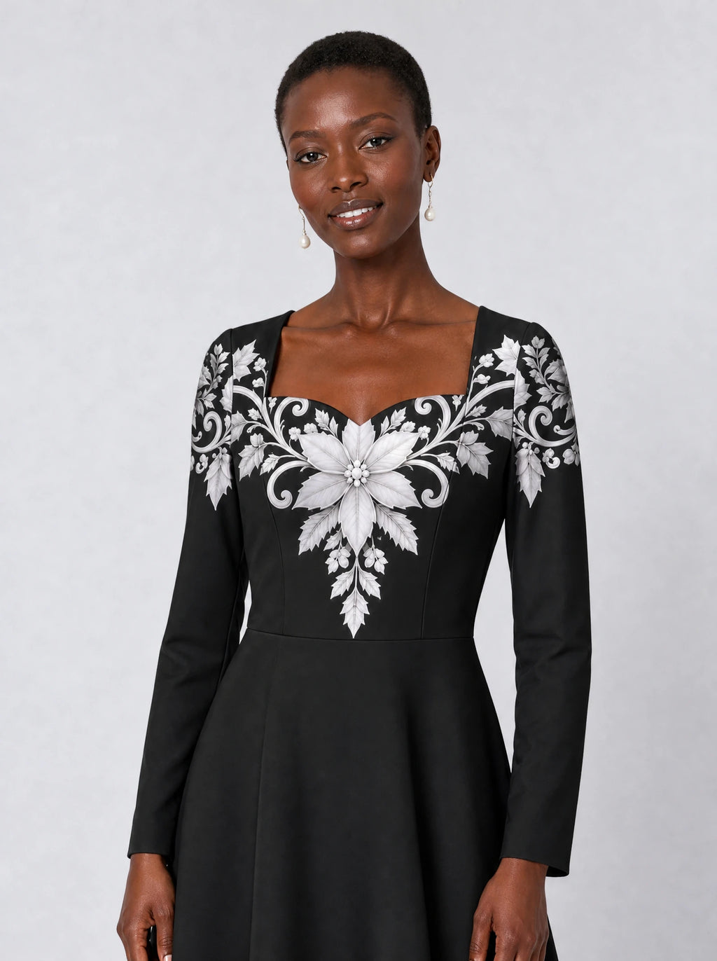 "Shwari" Long Sleeve Sweetheart Midi Dress — print close-up on model