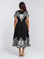 "Shwari" Sweetheart Midi Dress — back view on model