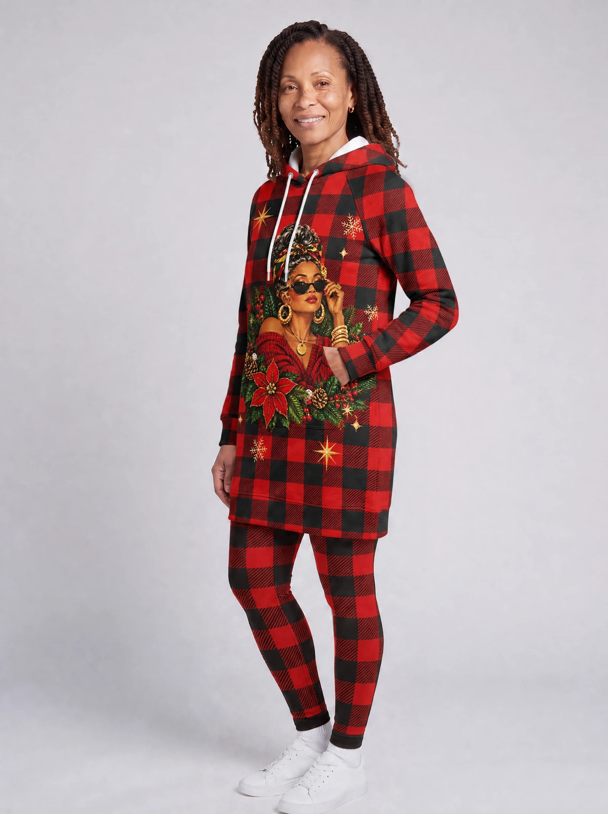 "Sikukuu" Christmas Hoodie Dress — three-quarter view on model, hand in pocket, styled with the matching leggings