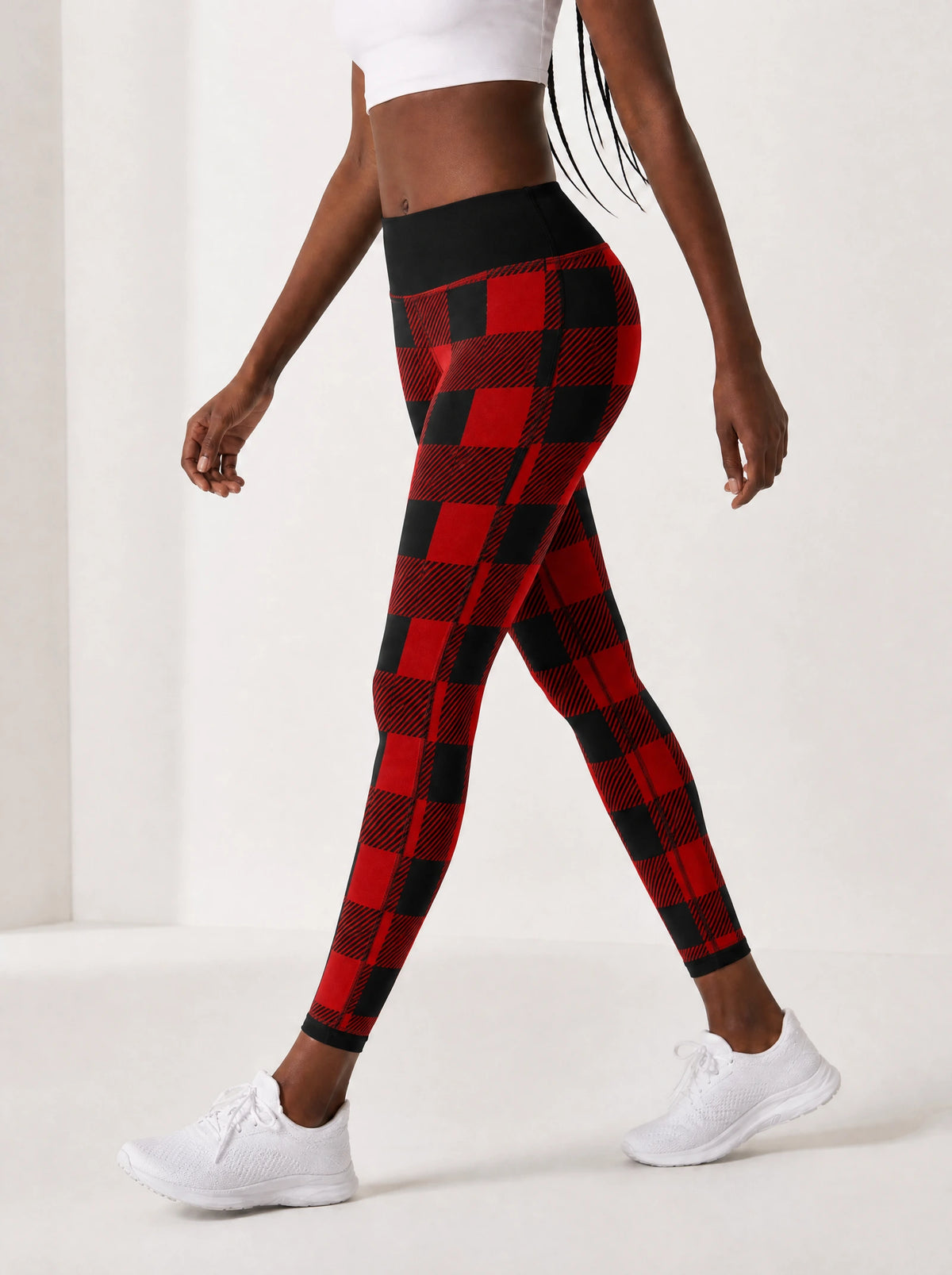 "Sikukuu" Christmas Leggings — side view on model, walking