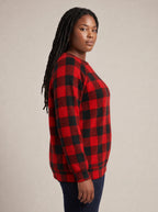 "Sikukuu" Christmas Sweatshirt — side view on model