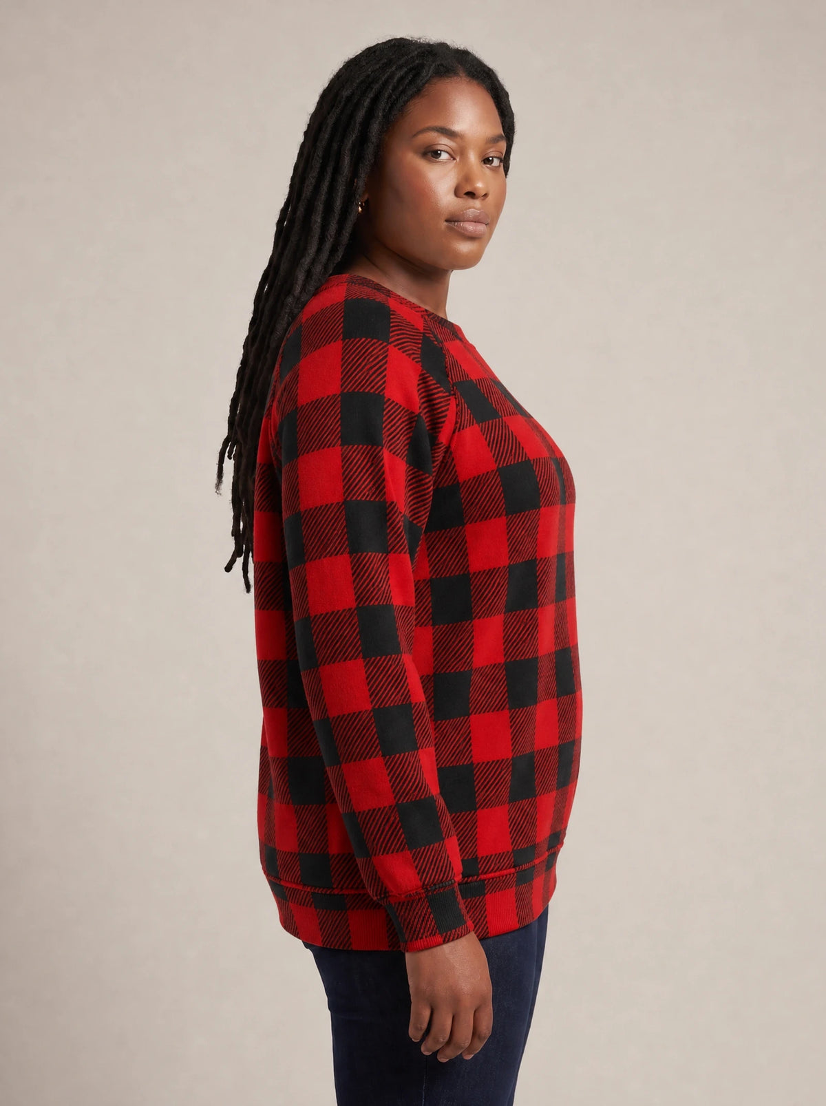 "Sikukuu" Christmas Sweatshirt — side view on model