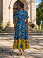 "Sitara" Short Sleeve Maxi Dress — back view on model in the churchyard