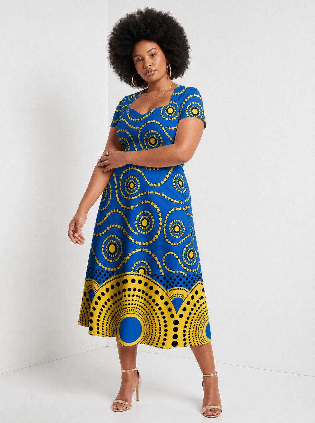 "Sitara" Sweetheart Midi Dress — walking, three-quarter view on model