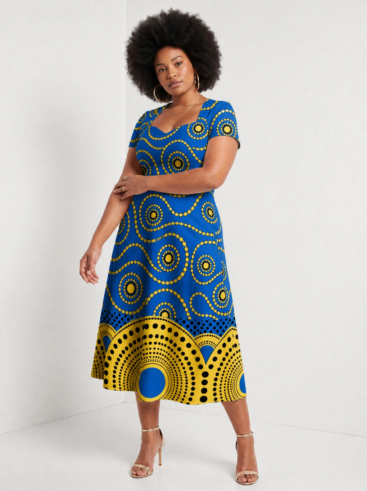 "Sitara" Sweetheart Midi Dress — walking, three-quarter view on model