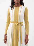 "Sphinx" Long Sleeve Midaxi Dress — standing, angled view on model