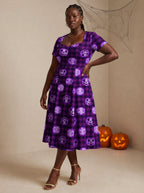 "Tabasamu" Halloween Sweetheart Midi Dress — three-quarter view on model