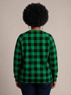 "Theluji" Christmas Sweatshirt — back view on model